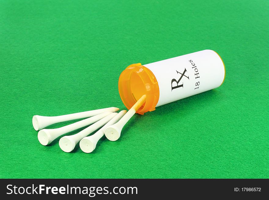 Prescription medicine bottle filled with golf tees; green felt background. Prescription medicine bottle filled with golf tees; green felt background.