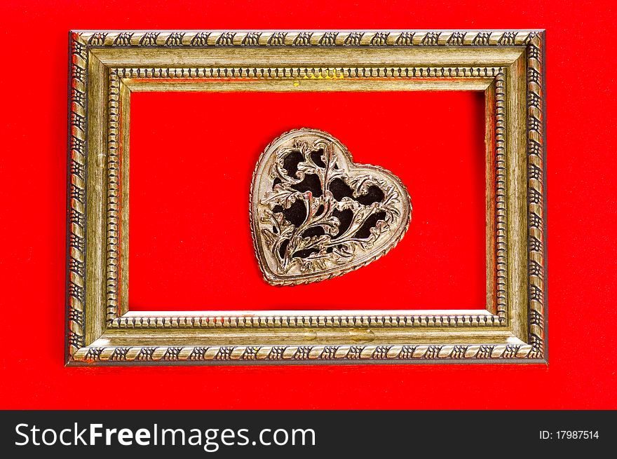 Old decorative heart in bronse frame. Old decorative heart in bronse frame