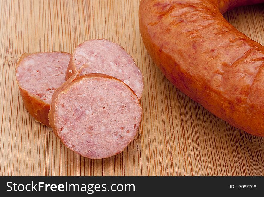 Fatty home smoked sausage on the kitchen blackboard.