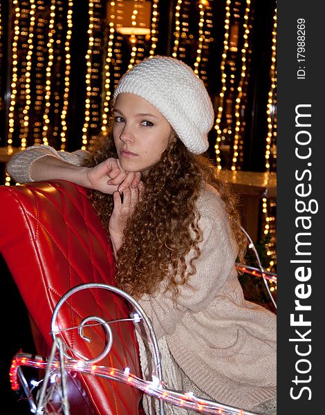 Pretty teenage girl in beret  with fire-lights