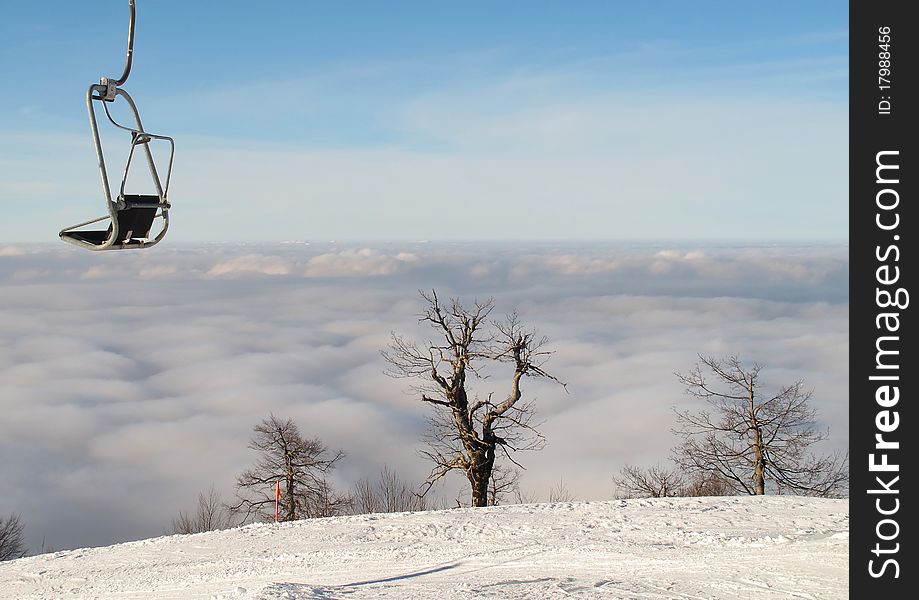 Ski lift above the clouds