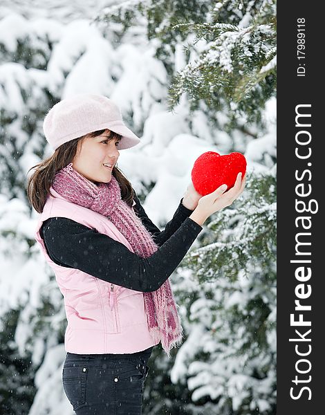 Teen girl heart in his hands at the Winter Park