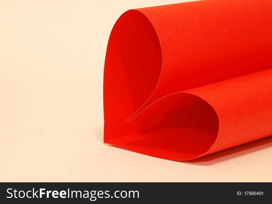 A red paper on a white background. A red paper on a white background