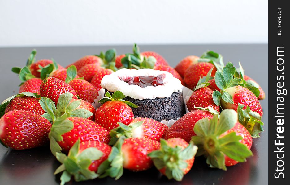 Strawberries and chocolate cake with cream. Strawberries and chocolate cake with cream