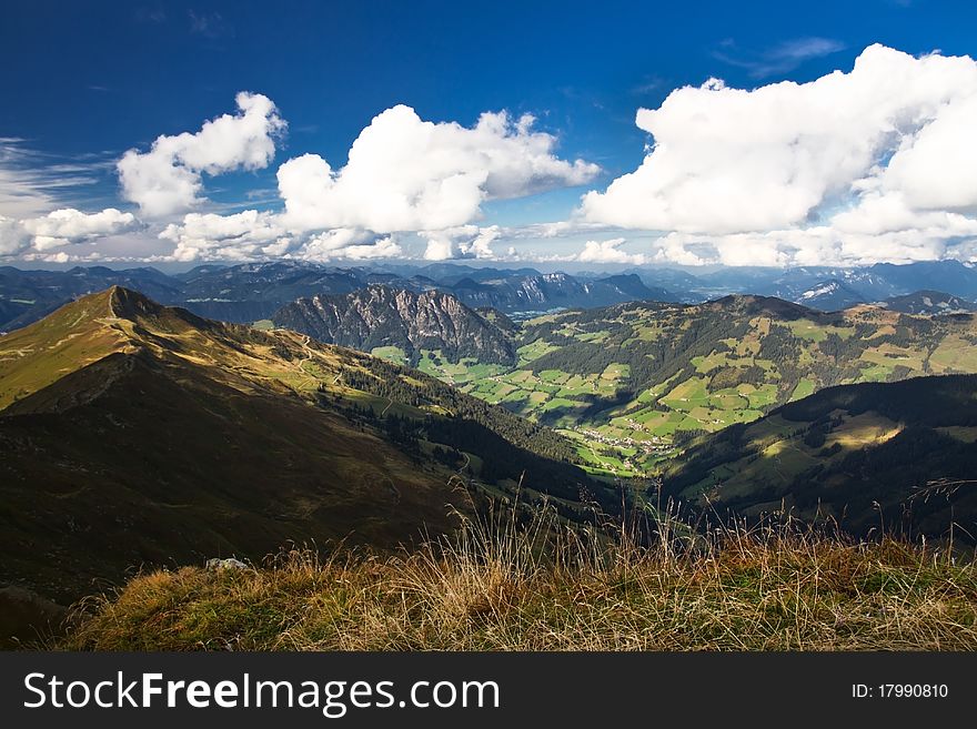 Mountain landscape in Austria with view into the valley with cloudy sky