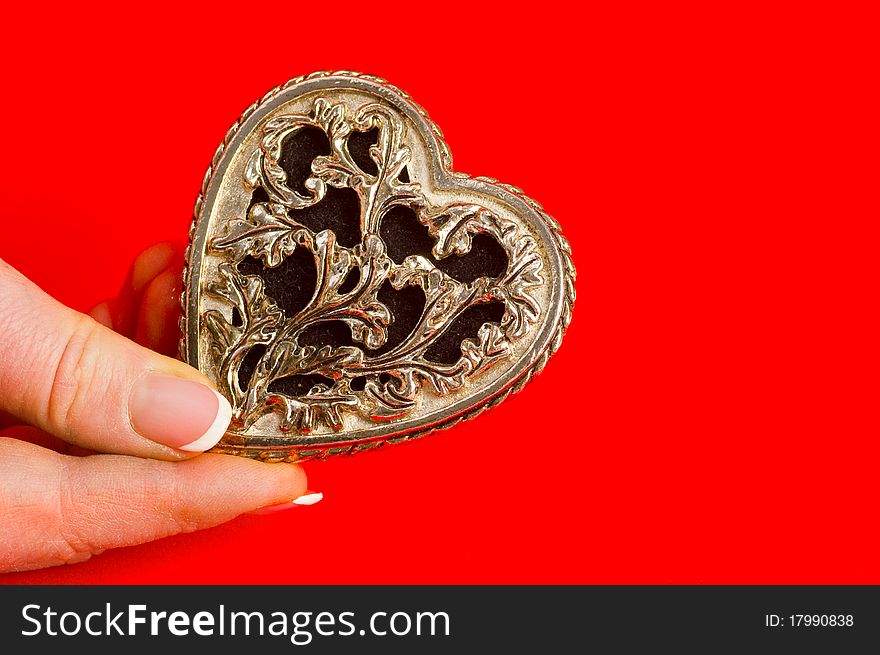 Bronse antique heart in hand