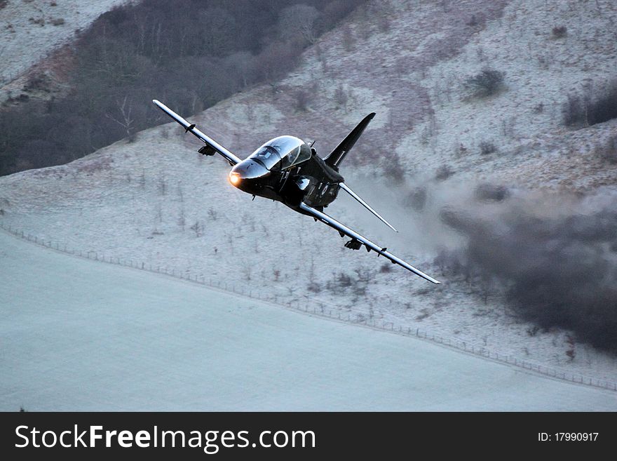 Hawk jet fighter low flying in Wales England