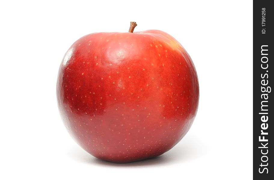 A shiny red apple isolated on a white background