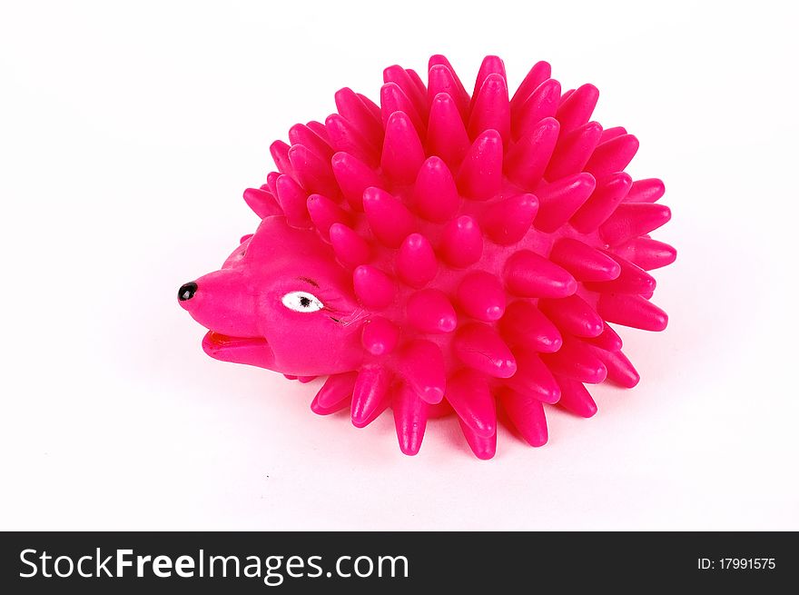 Rose hedgehog toy on a white background