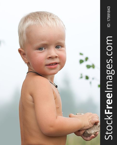 Portrait of young adorable boy against forest. Portrait of young adorable boy against forest