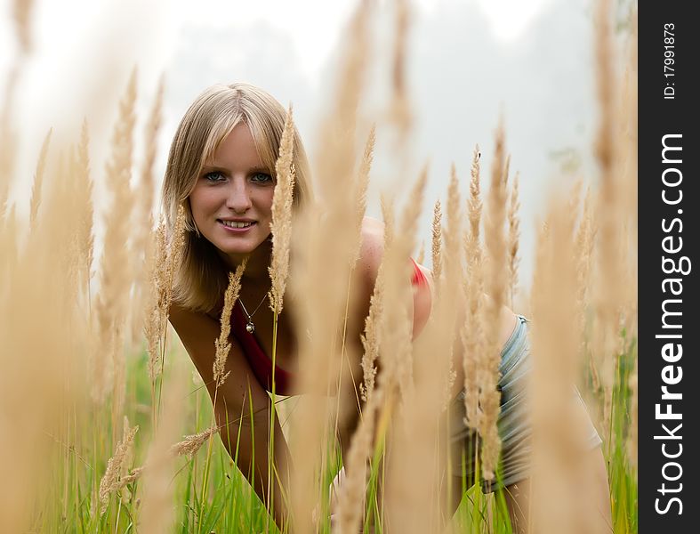 In The Field young lady smile. fog