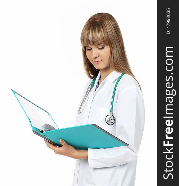 Pretty young female doctor holds a colorful folder. Pretty young female doctor holds a colorful folder