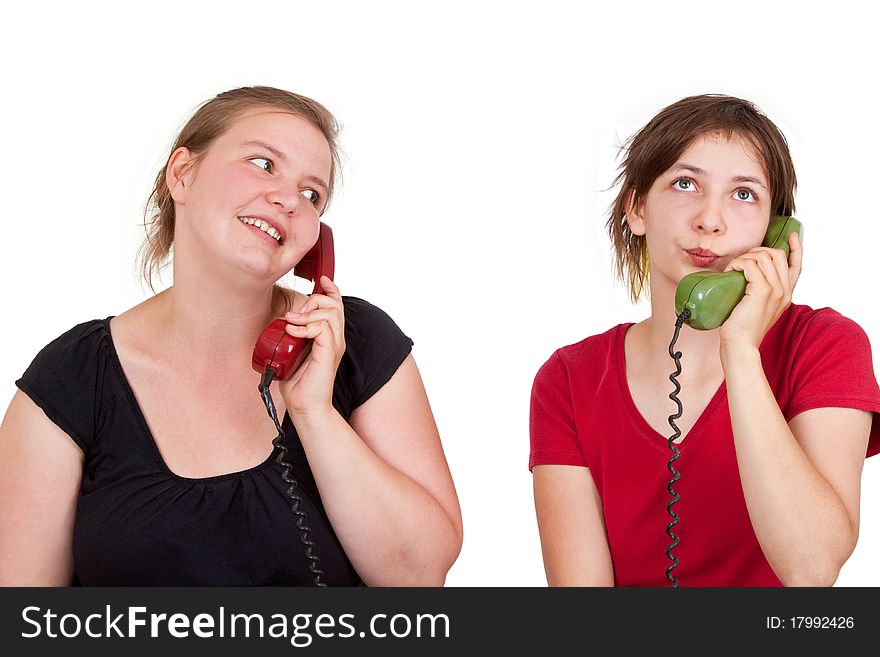 Two young women telephoning - isolated. Two young women telephoning - isolated