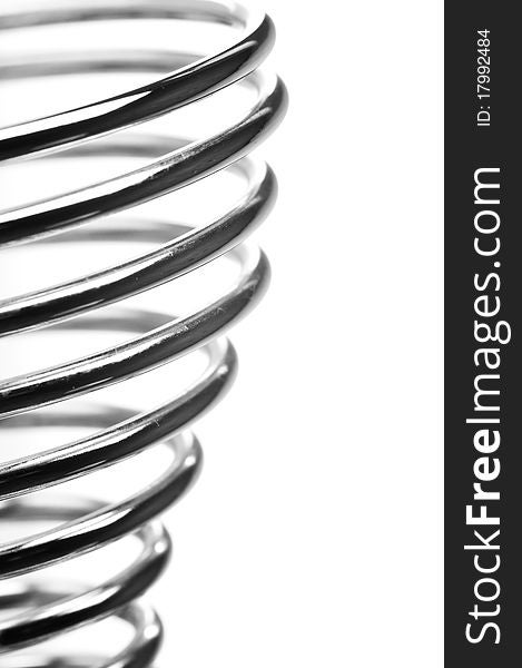 Metal spring on white background