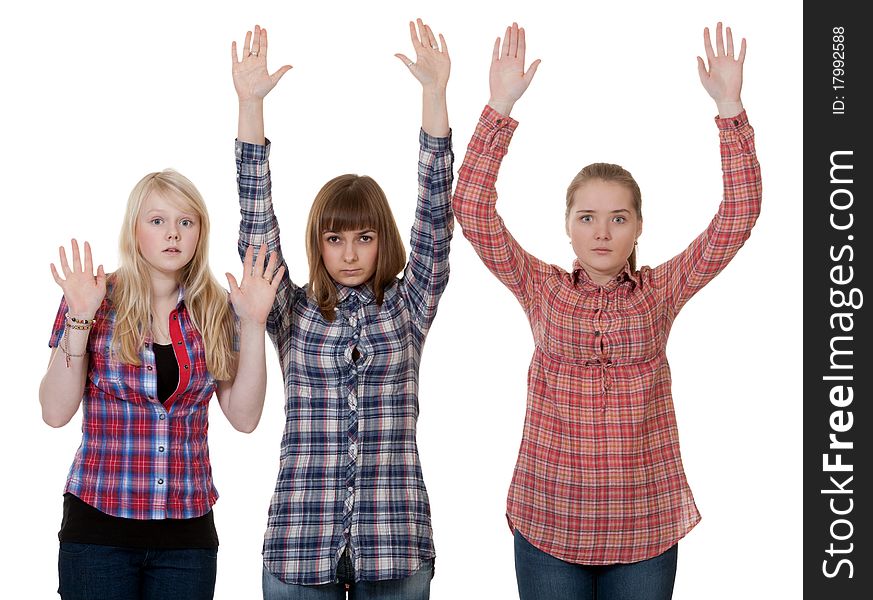 Three friends raised their hands up on a white background