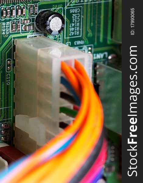 Macro view of electronic circuit board with connected power wires. Macro view of electronic circuit board with connected power wires