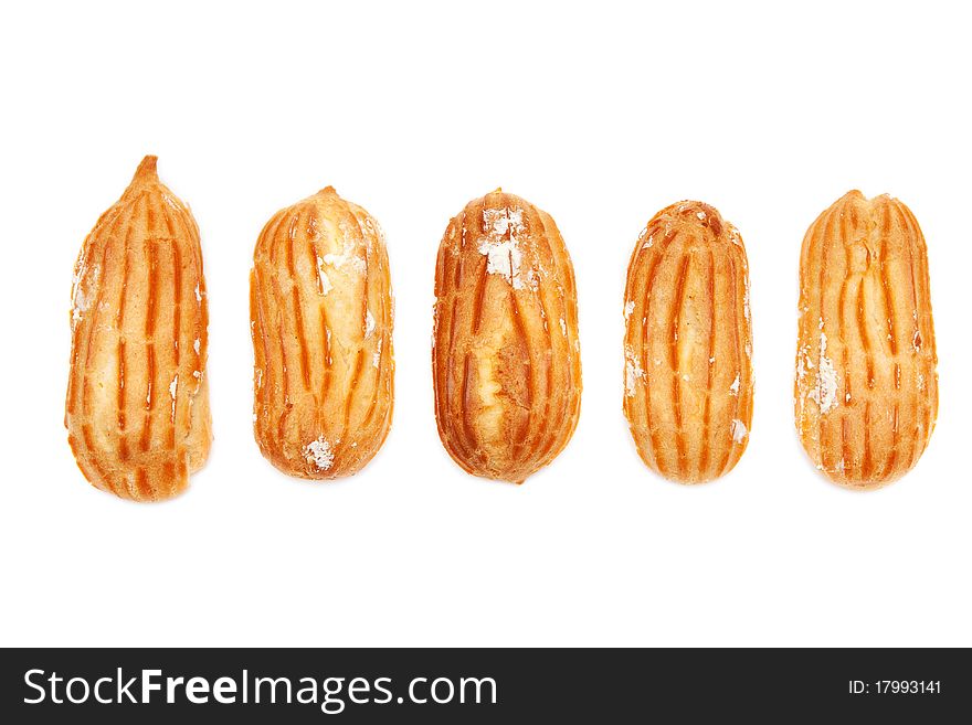 Delicious eclairs arranged unlikely on a white background