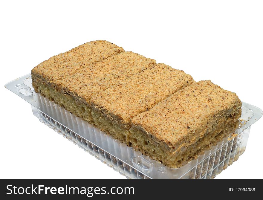 Four cakes in the plastic container isolated on the white background