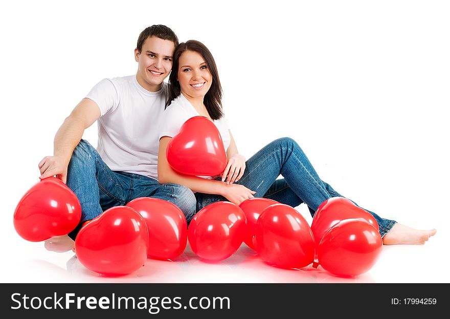 Couple with a red heart on white background