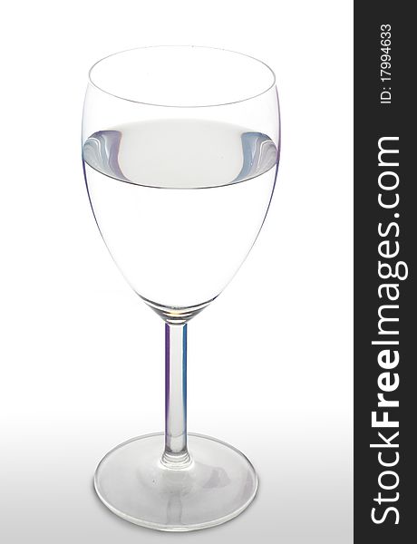 Water in a wineglasse on a wite background. Water in a wineglasse on a wite background.