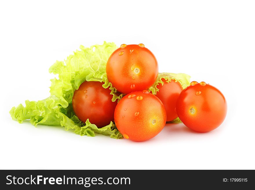 Cherry tomatoes and lettuce on a white