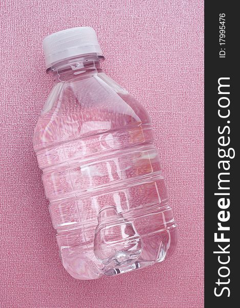 Bottled Water On A Pink Background