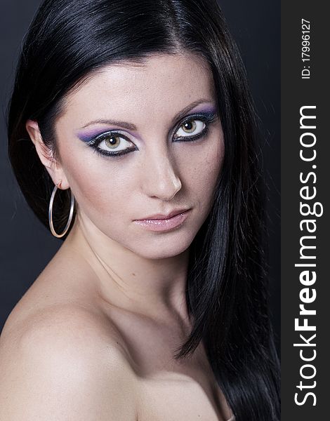 Brunette Woman With Blue And Purple Makeup