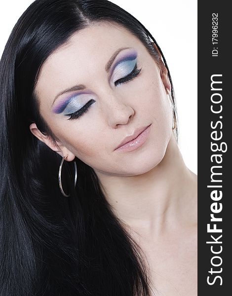 Attractive brunette woman with blue and purple makeup