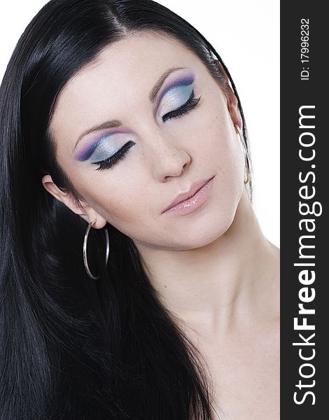 Brunette woman with blue and purple makeup