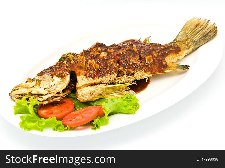 Fried snapper with chili sauce on the plate