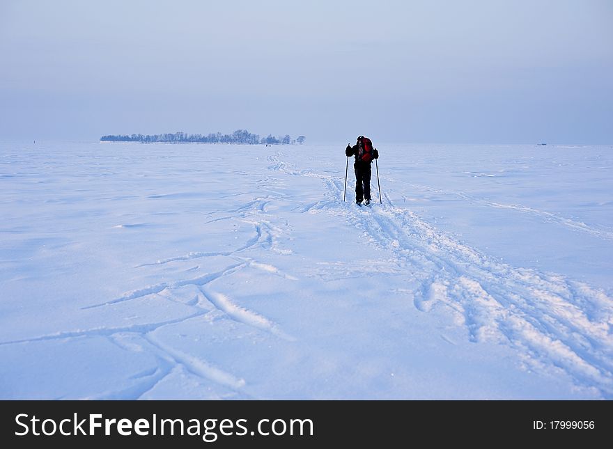 Cross-country skiing man in deep ski tracks. Cross-country skiing man in deep ski tracks