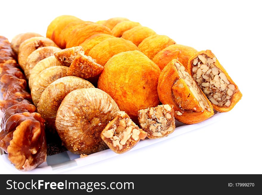 Dried fruits in tray  isolated on white background.