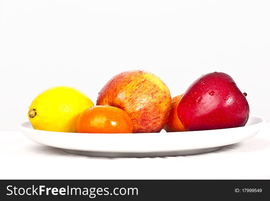 Mixed fruits lying on a plate