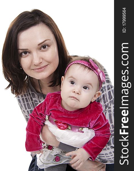 Mother with her sweet little daughter isolated on white. Mother with her sweet little daughter isolated on white.