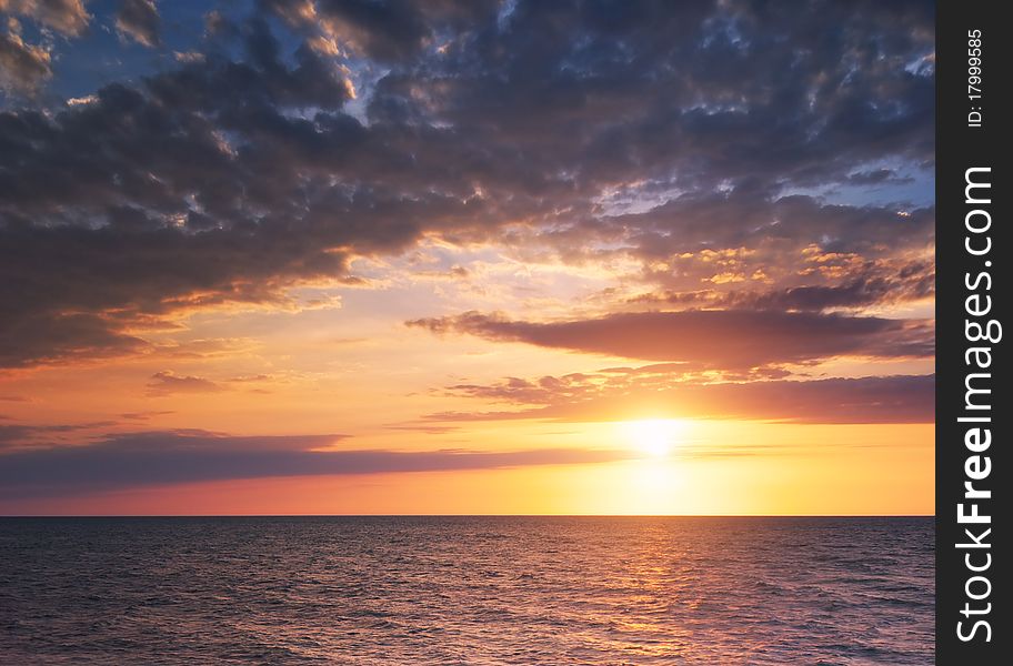 Beautiful seascape. Sea and rock at the sunset. Nature composition.