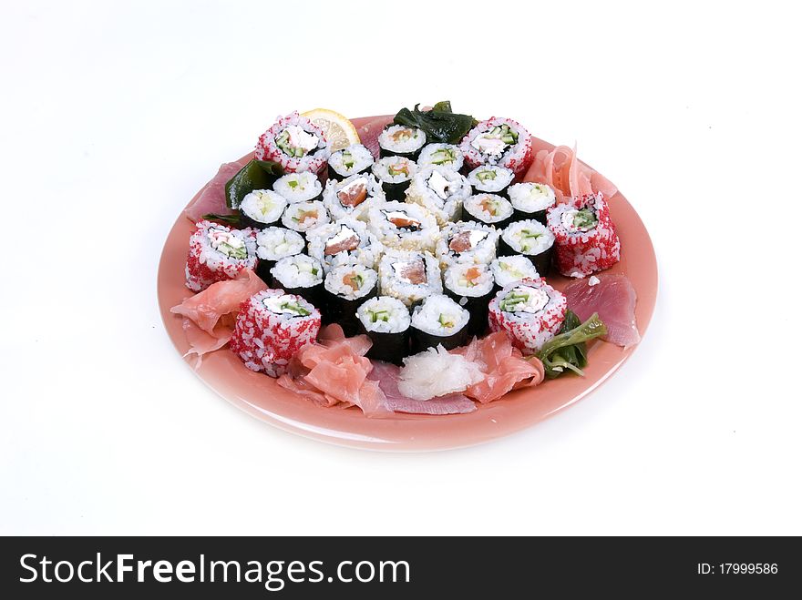Collection of different rolls served on the round plate. Collection of different rolls served on the round plate