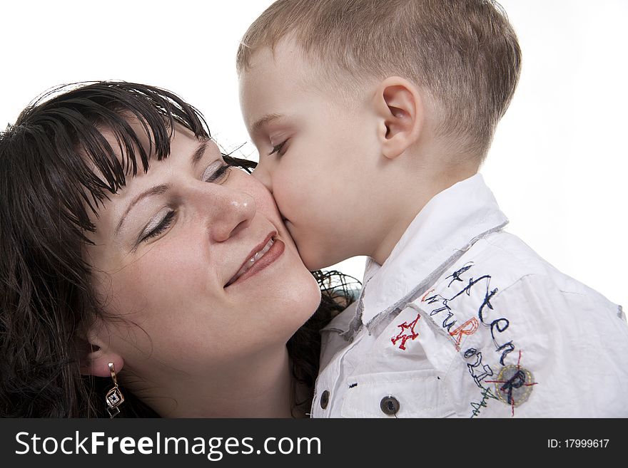 Happy mother embraces the son on a white background. Happy mother embraces the son on a white background