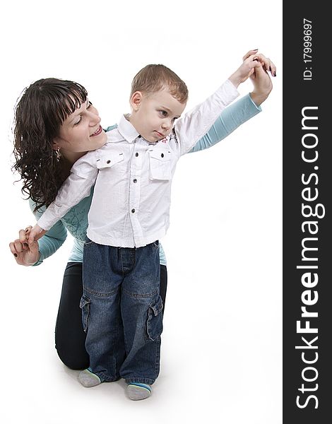 Happy mother embraces the son on a white background. Happy mother embraces the son on a white background