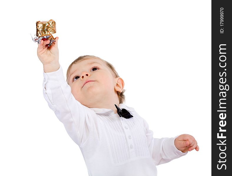 The little boy pulls a hand upwards over white