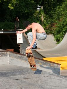 Skateboarder Grabbing Board Royalty Free Stock Photos