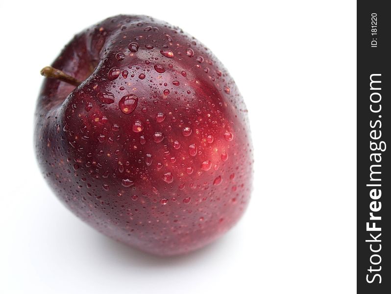 Isolated red apple with water droplets. Isolated red apple with water droplets