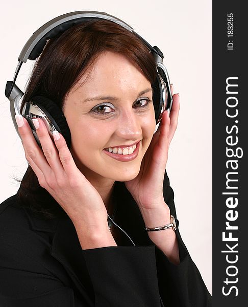 Businesswoman listening to music