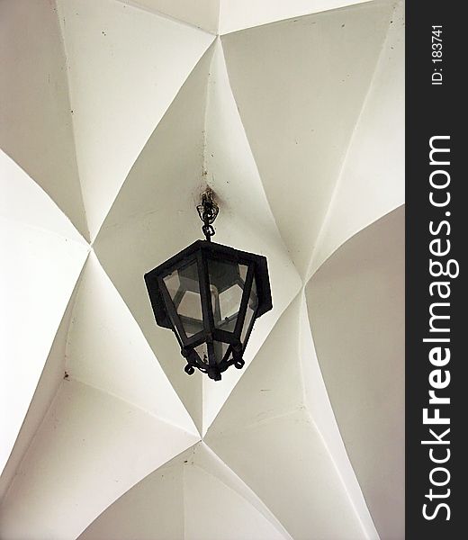 White gothic arch with lamp