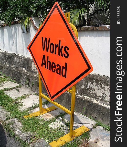 Orange Works Ahead sign