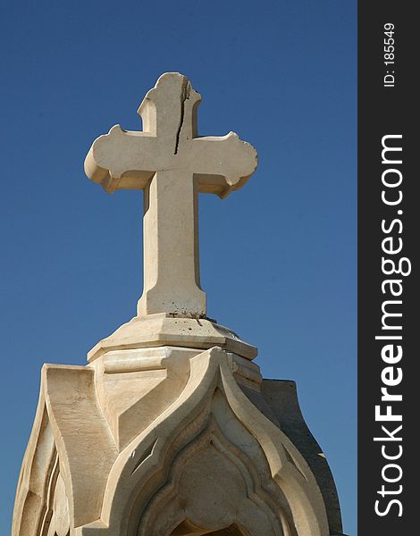 Cemetery Cross against clear blue sky