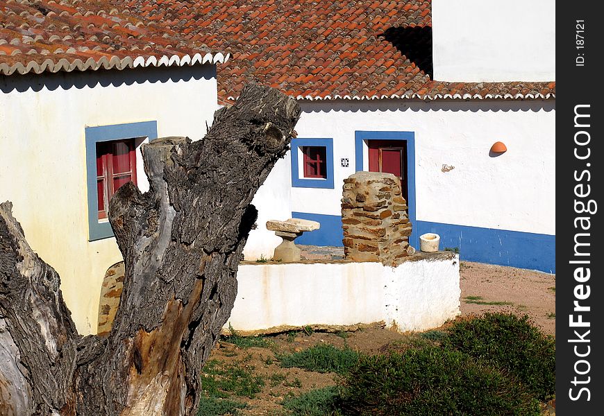 Traditional rural house of the south of Portugal. The colors are typical, with white walls (to minimize the heat of the sun) and blue frames. Traditional rural house of the south of Portugal. The colors are typical, with white walls (to minimize the heat of the sun) and blue frames