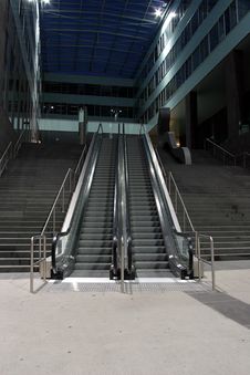 Escalators Between Stairs At Night Stock Image