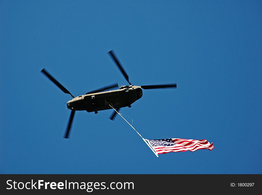 The American Flag under a helicopter. The American Flag under a helicopter