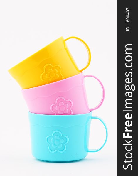 Three stacked toy tea cups. Three stacked toy tea cups