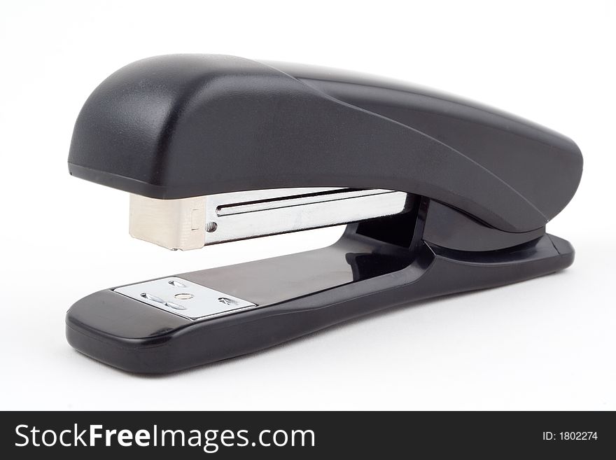 Black unbranded stapler on white background, isolated. Black unbranded stapler on white background, isolated.